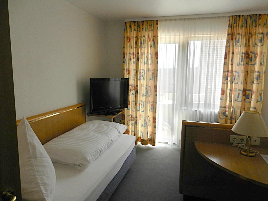 Postel nebo postele na pokoji v ubytování Hotel Gasthof Herderich