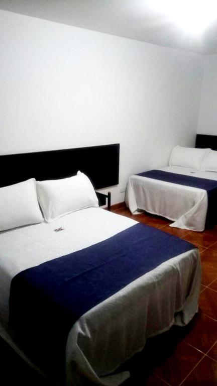 Postel nebo postele na pokoji v ubytování Hotel Casa Guillermo