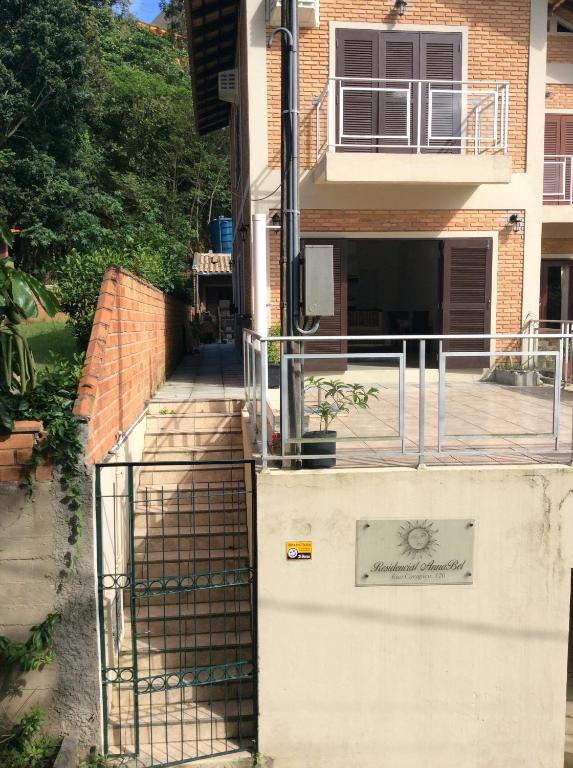 a building with a gate on the side of it at RESIDENCIAL ANNABEL APTO 03 in Bombinhas