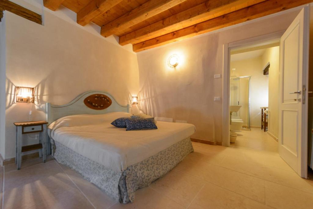 Postel nebo postele na pokoji v ubytování B&B Corte Jago