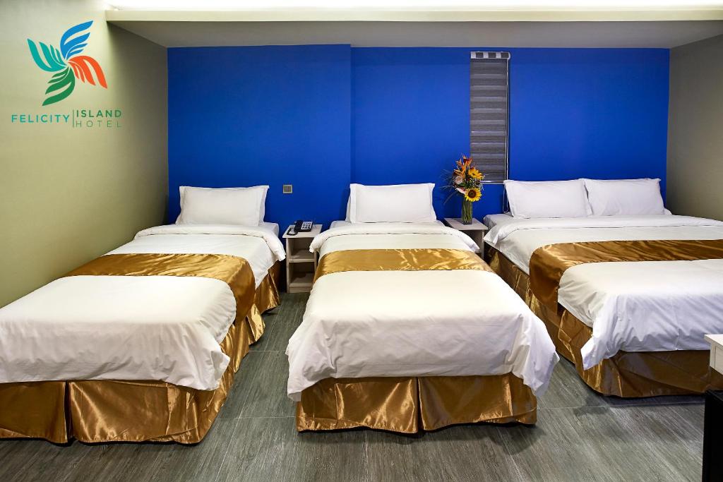 Katil atau katil-katil dalam bilik di Felicity Island Hotel