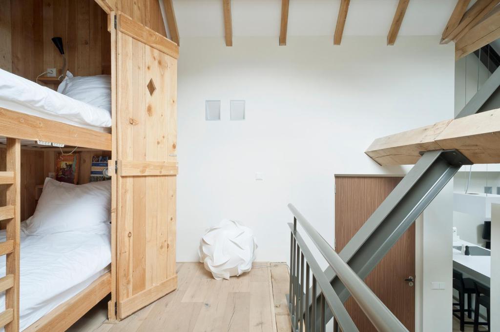 Postel nebo postele na pokoji v ubytování Cour 8 Lofts