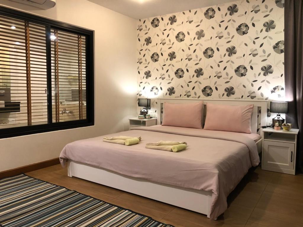 Postel nebo postele na pokoji v ubytování WOW Apartment at Unity Patong