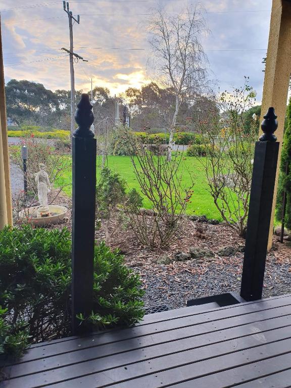 a view of a garden from the porch of a house at Chateau Bass in Bass
