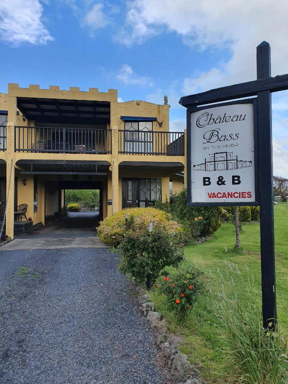 a sign in front of a building with a restaurant at Chateau Bass in Bass