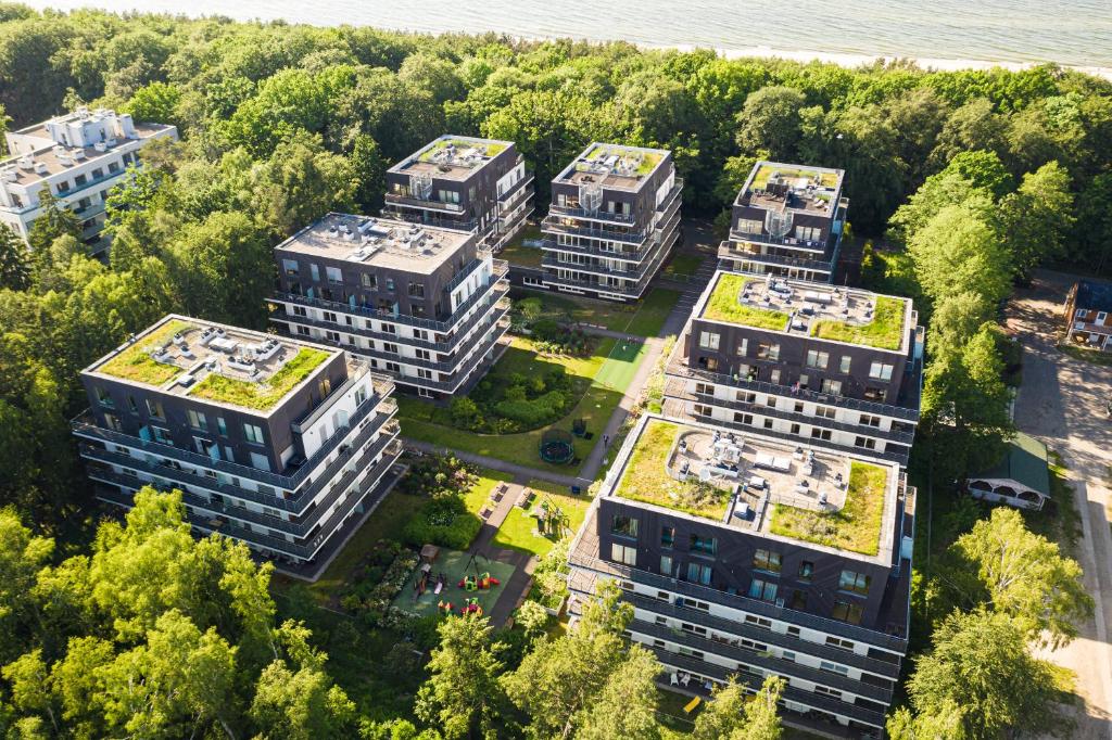 an overhead view of buildings with green roofs at Apartamenty Tulipan - visitopl in Międzyzdroje