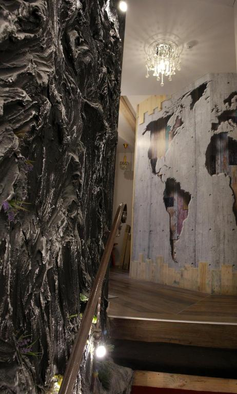 a wall with a map of the world on it at DP Art Residence - self check in in Kaunas