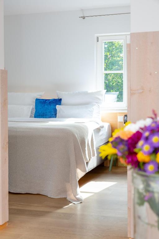Postel nebo postele na pokoji v ubytování hezelhof hotel