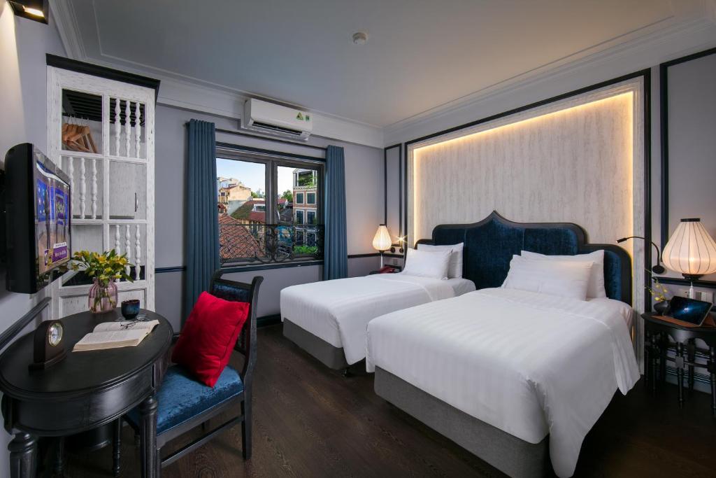 Postel nebo postele na pokoji v ubytování La Beaute Boutique Hotel & Spa