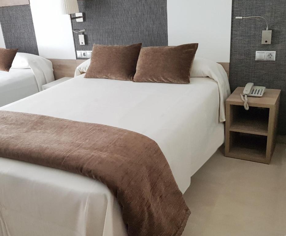 Posteľ alebo postele v izbe v ubytovaní Hotel Cesar Augustus