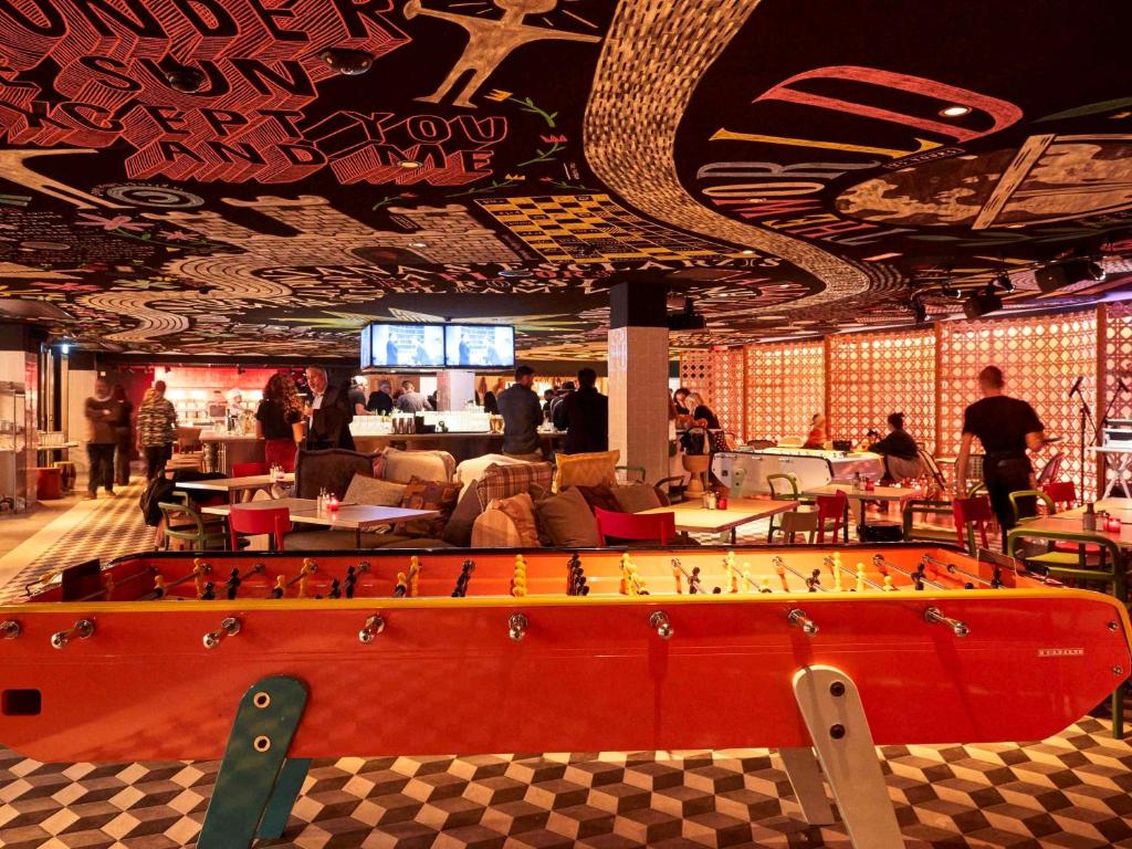 a room with a large board game in the middle of it at Mama Shelter Toulouse in Toulouse