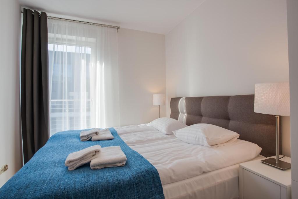 Postel nebo postele na pokoji v ubytování Apartamenty Tulipan - visitopl