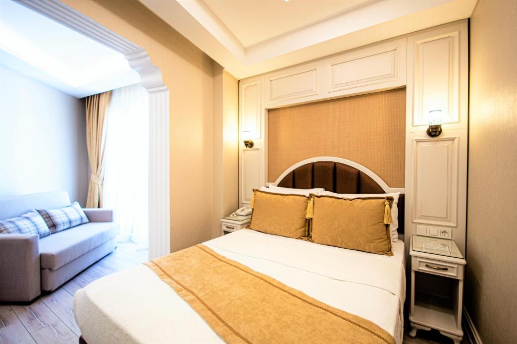 Postel nebo postele na pokoji v ubytování Boss Hotel Sultanahmet