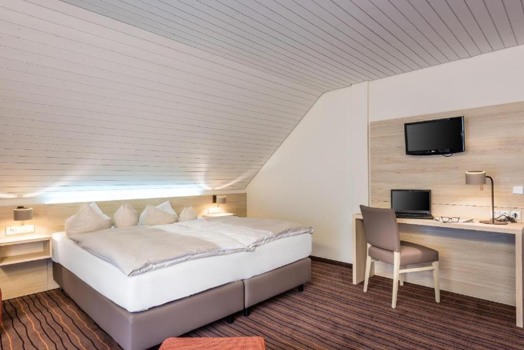 Postel nebo postele na pokoji v ubytování Business Class Hotel Häckermühle