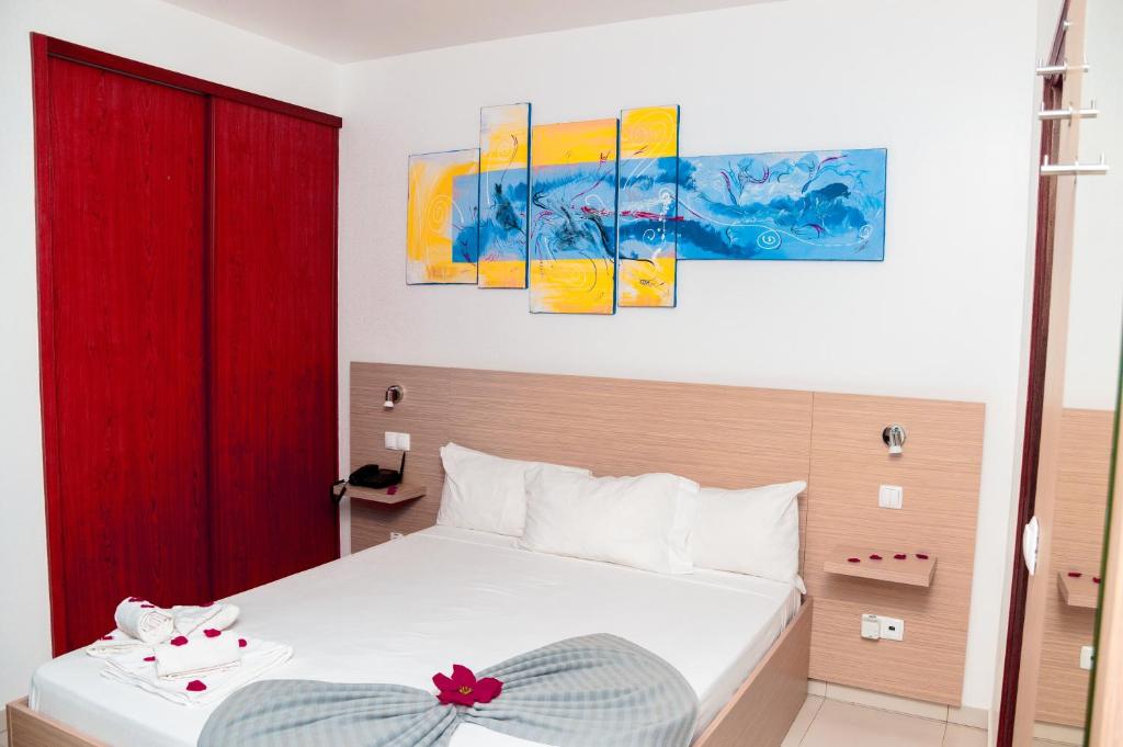 Postel nebo postele na pokoji v ubytování Hotel Cesaria