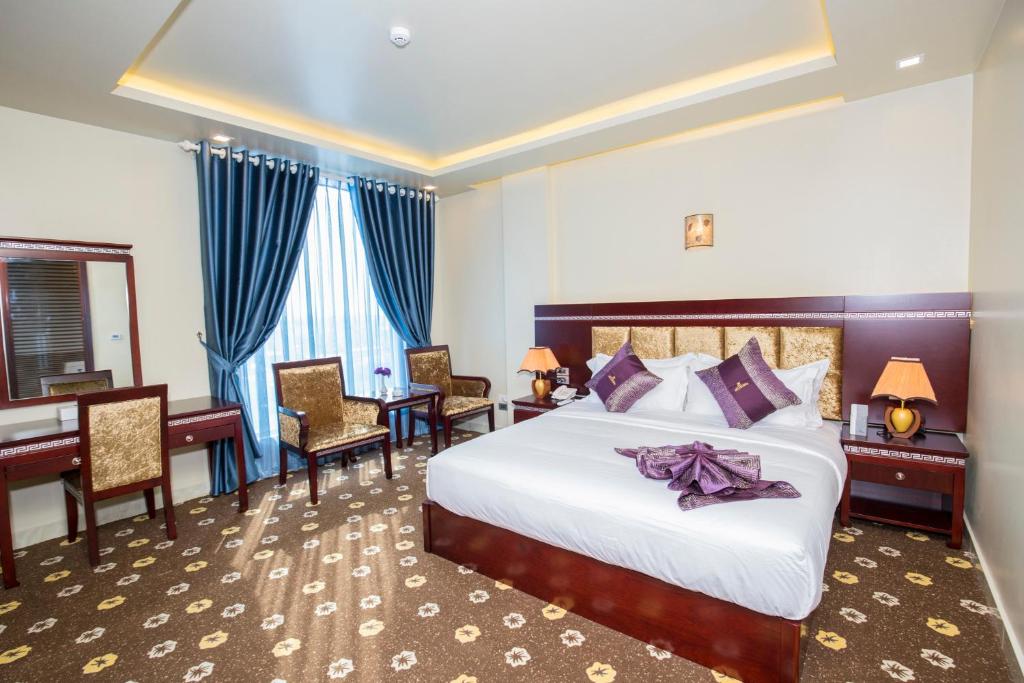 Giường trong phòng chung tại Gallant Hotel 168