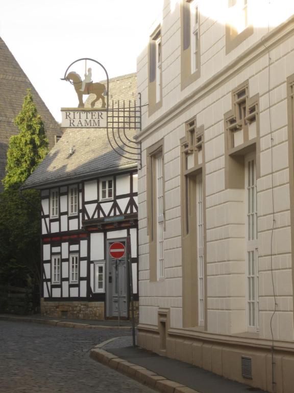 a black and white building next to a building at Galeriewohnung Ritter Ramm in Goslar