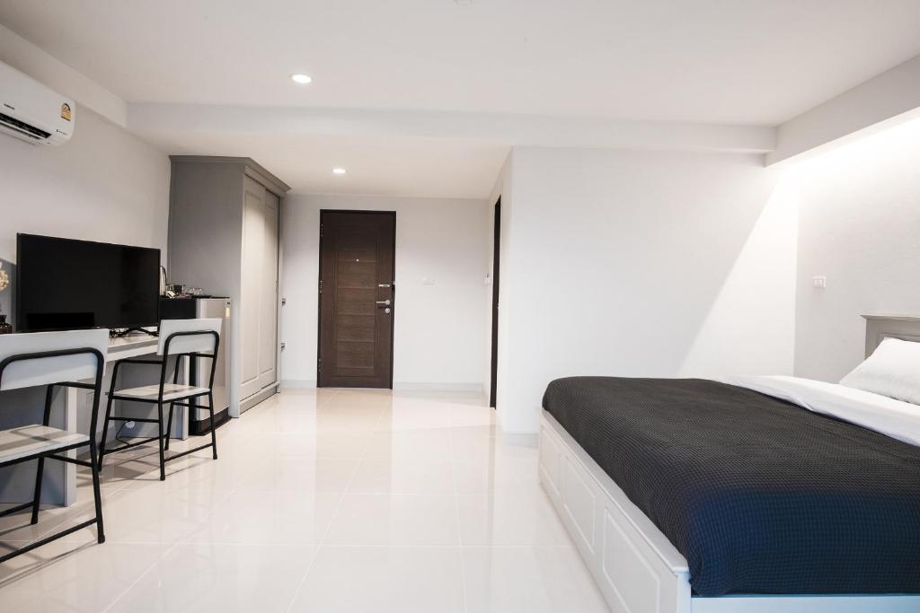 Postel nebo postele na pokoji v ubytování Tonkla Boutique Hotel