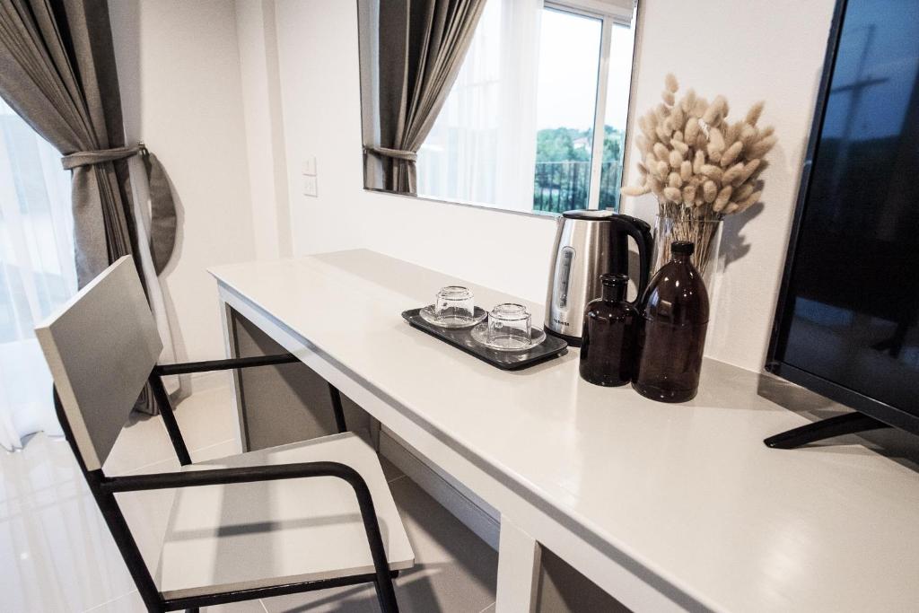 TV a/nebo společenská místnost v ubytování Tonkla Boutique Hotel