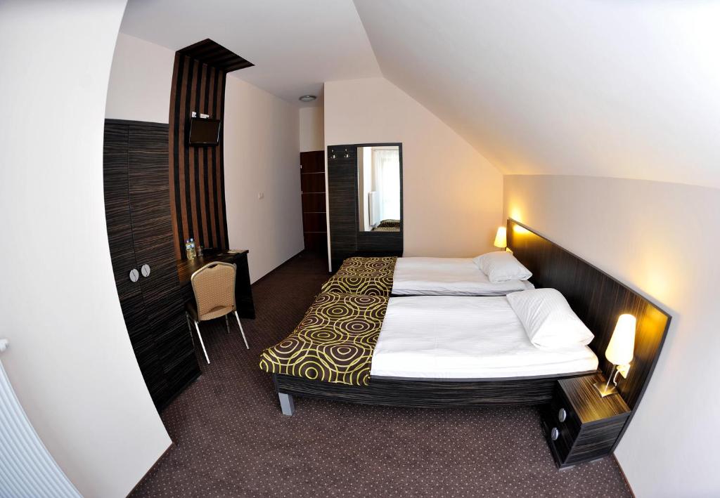 Postel nebo postele na pokoji v ubytování Hotel Sulbin