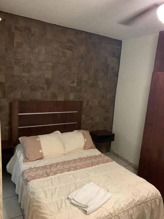 Postel nebo postele na pokoji v ubytování Hotel Posada San Juan