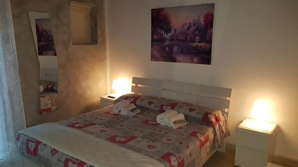 Posteľ alebo postele v izbe v ubytovaní La Terrazza sul Centro