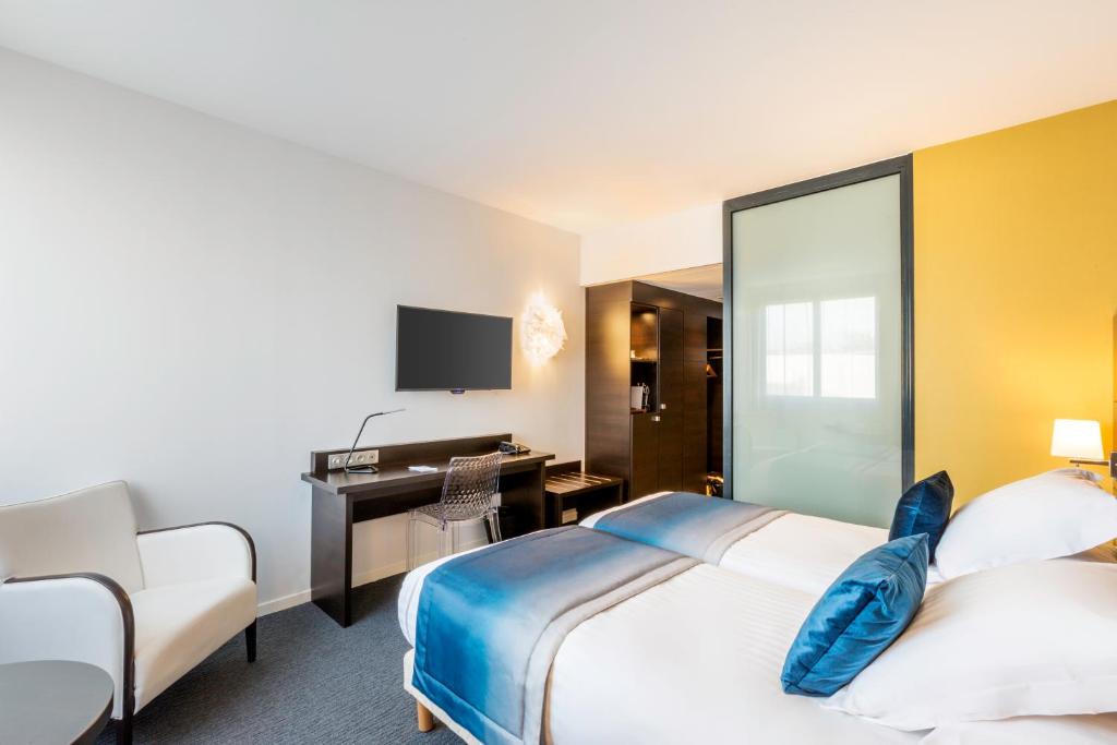Postel nebo postele na pokoji v ubytování Best Western Plus Europe Hôtel Brest