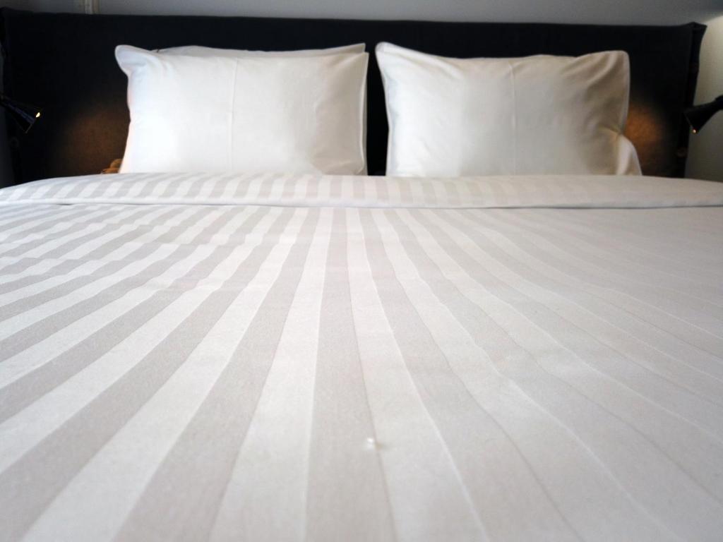 Posteľ alebo postele v izbe v ubytovaní ALL SEASONS Luxury Suites1