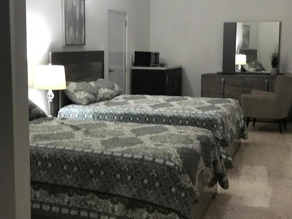Postel nebo postele na pokoji v ubytování Itza-Bella Suites