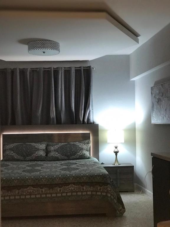 Postel nebo postele na pokoji v ubytování Itza-Bella Suites