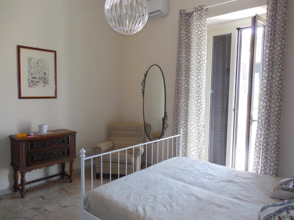 Postel nebo postele na pokoji v ubytování Giardino della Nonna Bice - locazioni turistiche