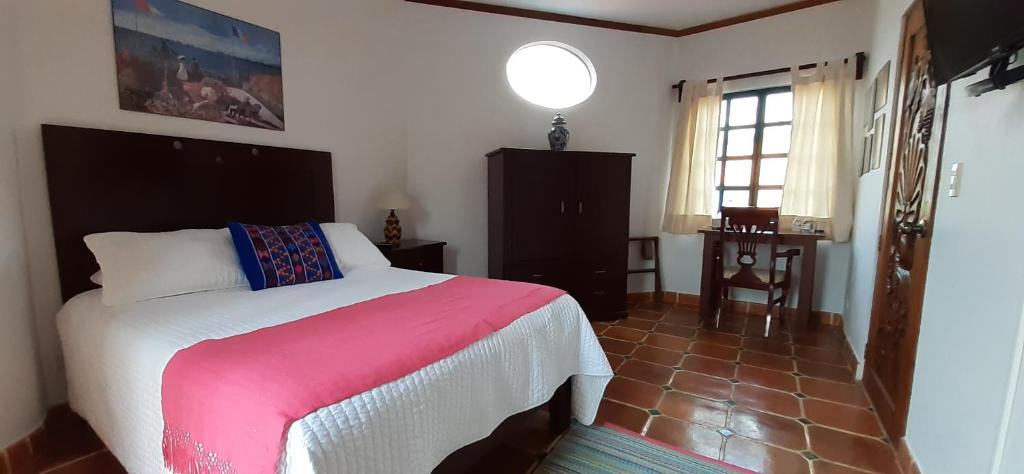 Postel nebo postele na pokoji v ubytování Casa Frida B&B