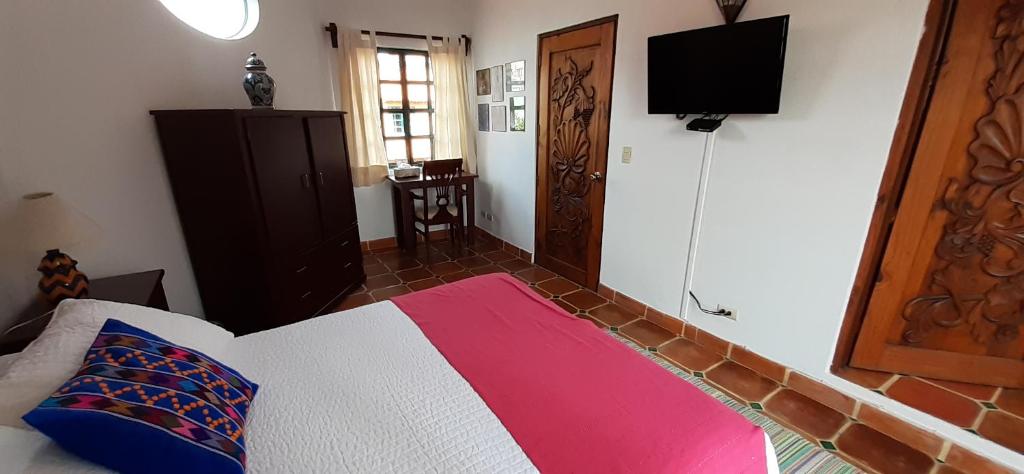 Postel nebo postele na pokoji v ubytování Casa Frida B&B