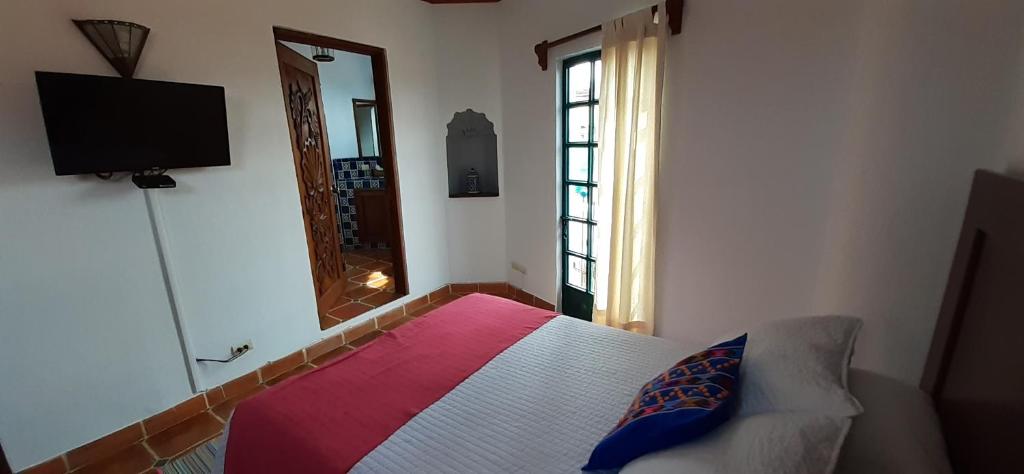 Postel nebo postele na pokoji v ubytování Casa Frida B&B