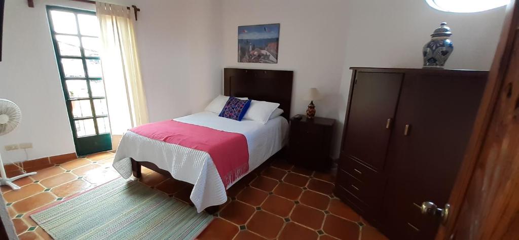 Postel nebo postele na pokoji v ubytování Casa Frida B&B