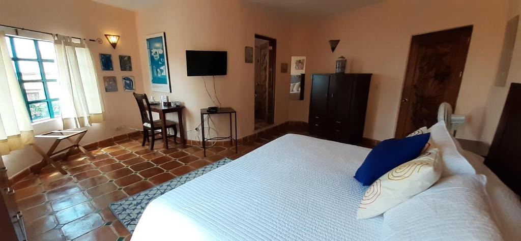 Postel nebo postele na pokoji v ubytování Casa Frida B&B