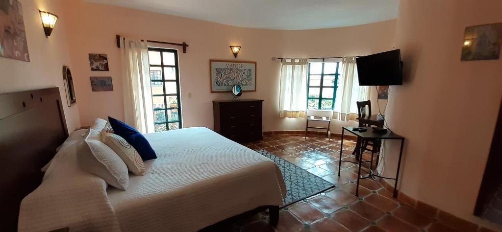 Postel nebo postele na pokoji v ubytování Casa Frida B&B