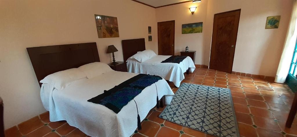 Postel nebo postele na pokoji v ubytování Casa Frida B&B