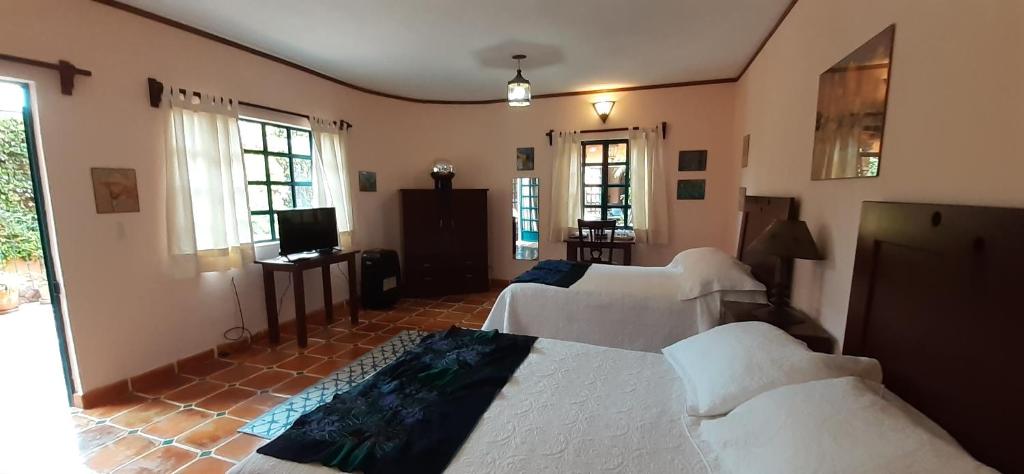 Postel nebo postele na pokoji v ubytování Casa Frida B&B
