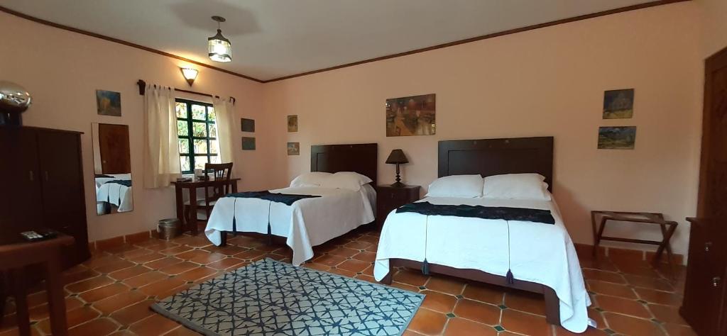 Postel nebo postele na pokoji v ubytování Casa Frida B&B