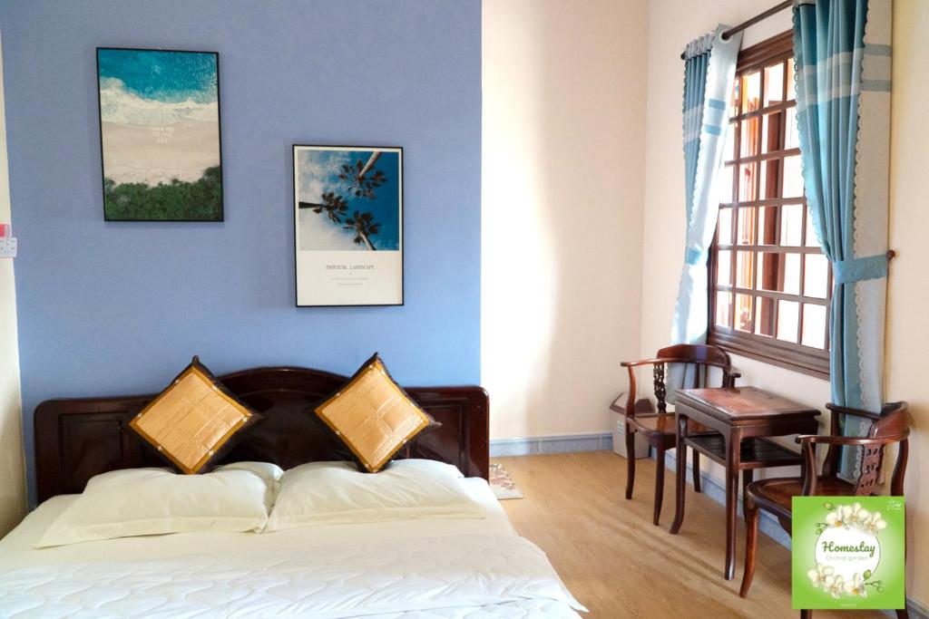 Giường trong phòng chung tại Can Tho Orchid Garden Homestay