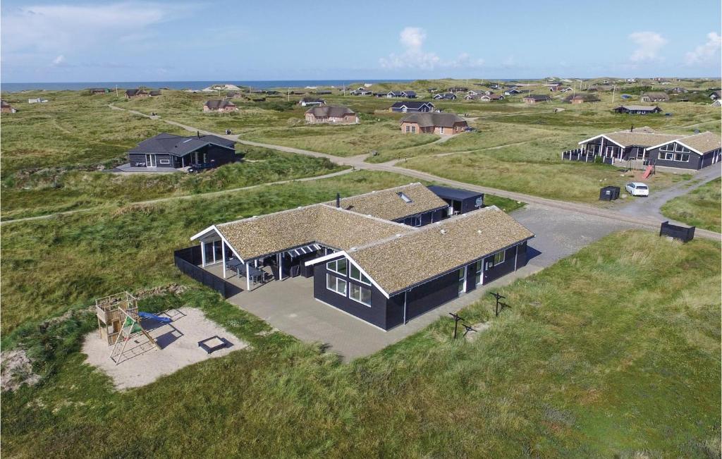 an overhead view of a house on the beach at Amazing Home In Ringkbing With 8 Bedrooms, Sauna And Wifi in Klegod