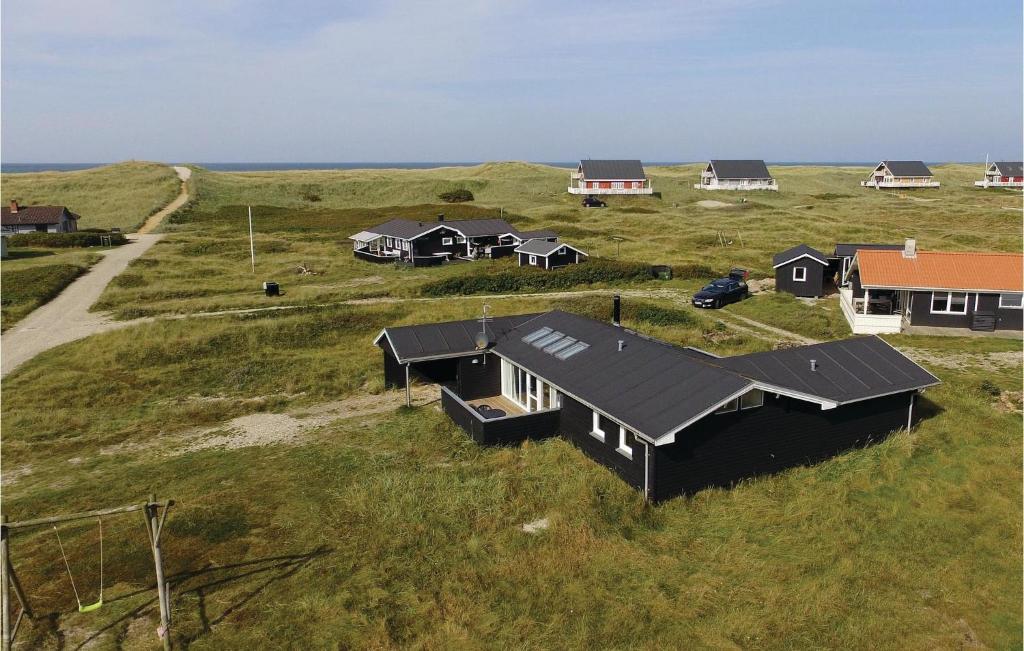 an overhead view of a house in a field at Stunning Home In Harbore With 3 Bedrooms And Wifi in Harboør