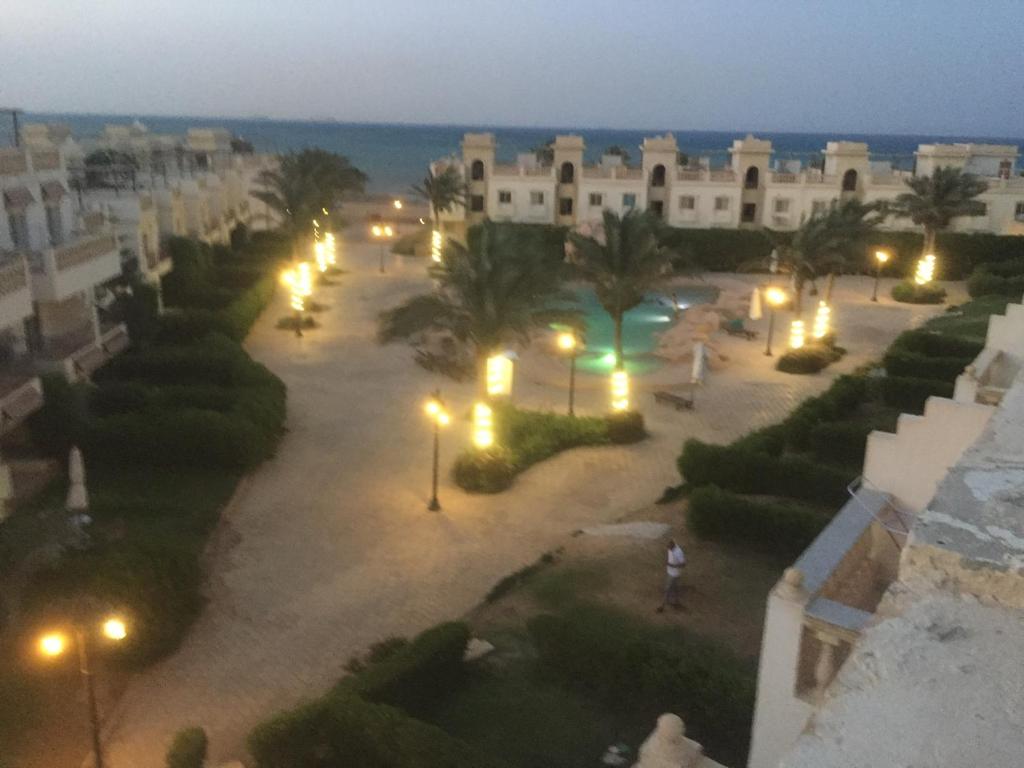 an aerial view of a courtyard at night with lights at Chalet in Belagio Ain Sokhna in Ain Sokhna