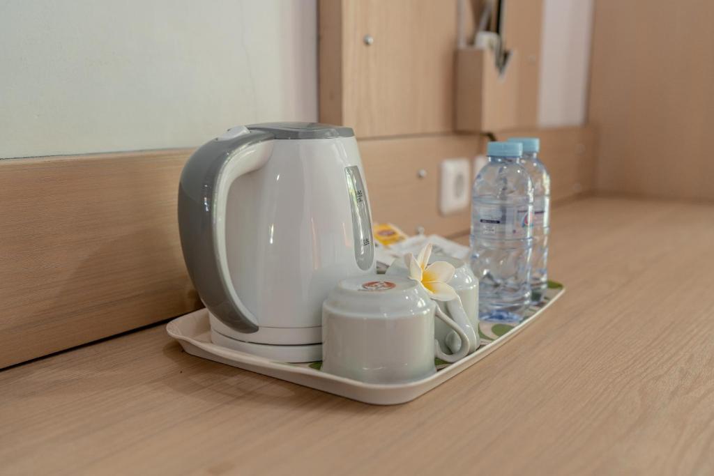 Příslušenství pro přípravu čaje a kávy v ubytování Bendesa Accommodation