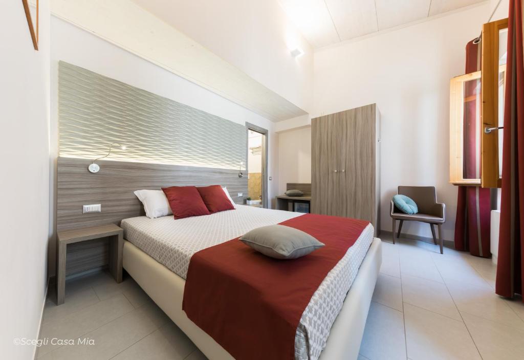Postel nebo postele na pokoji v ubytování Ottocento Guest House
