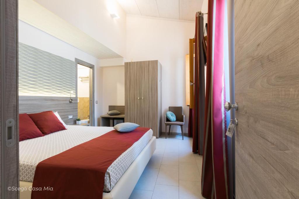 Postel nebo postele na pokoji v ubytování Ottocento Guest House
