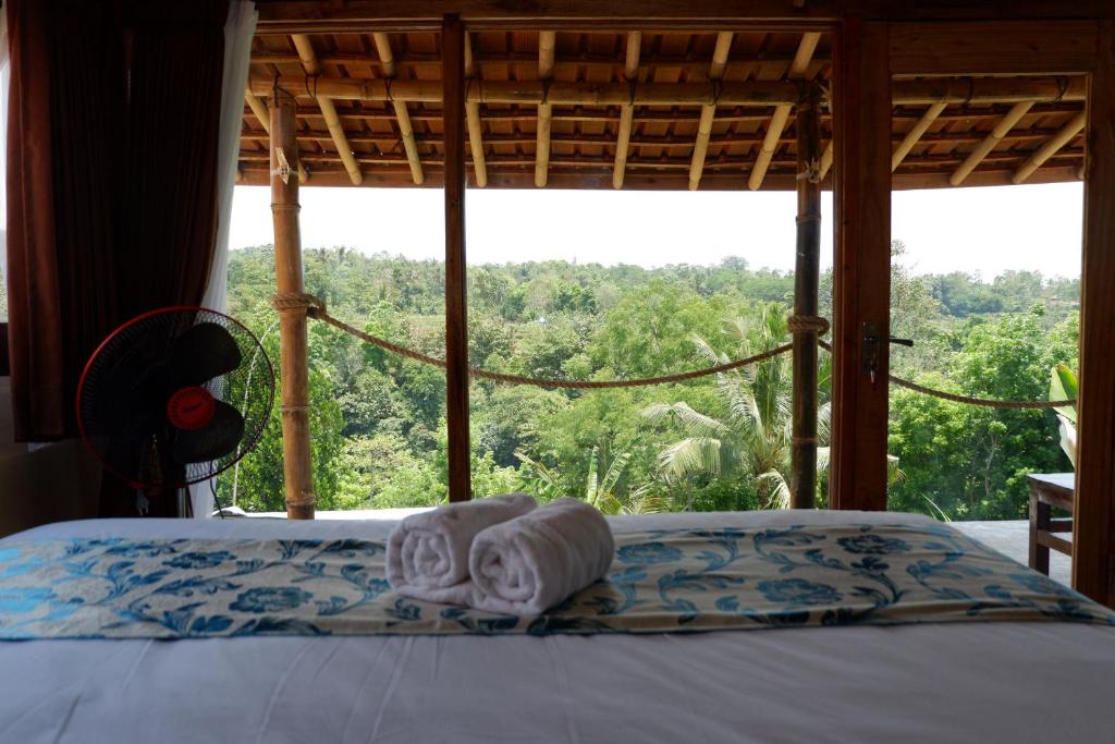 Postel nebo postele na pokoji v ubytování Padi Bali Jatiluwih