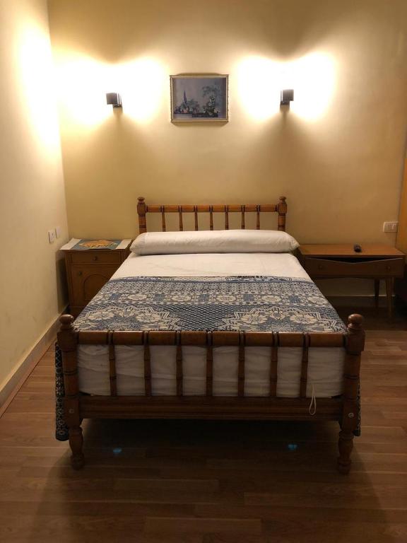 Postel nebo postele na pokoji v ubytování Tulip Hotel