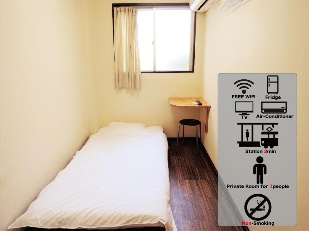 Postel nebo postele na pokoji v ubytování HOTEL LUCKY / Vacation STAY 3952